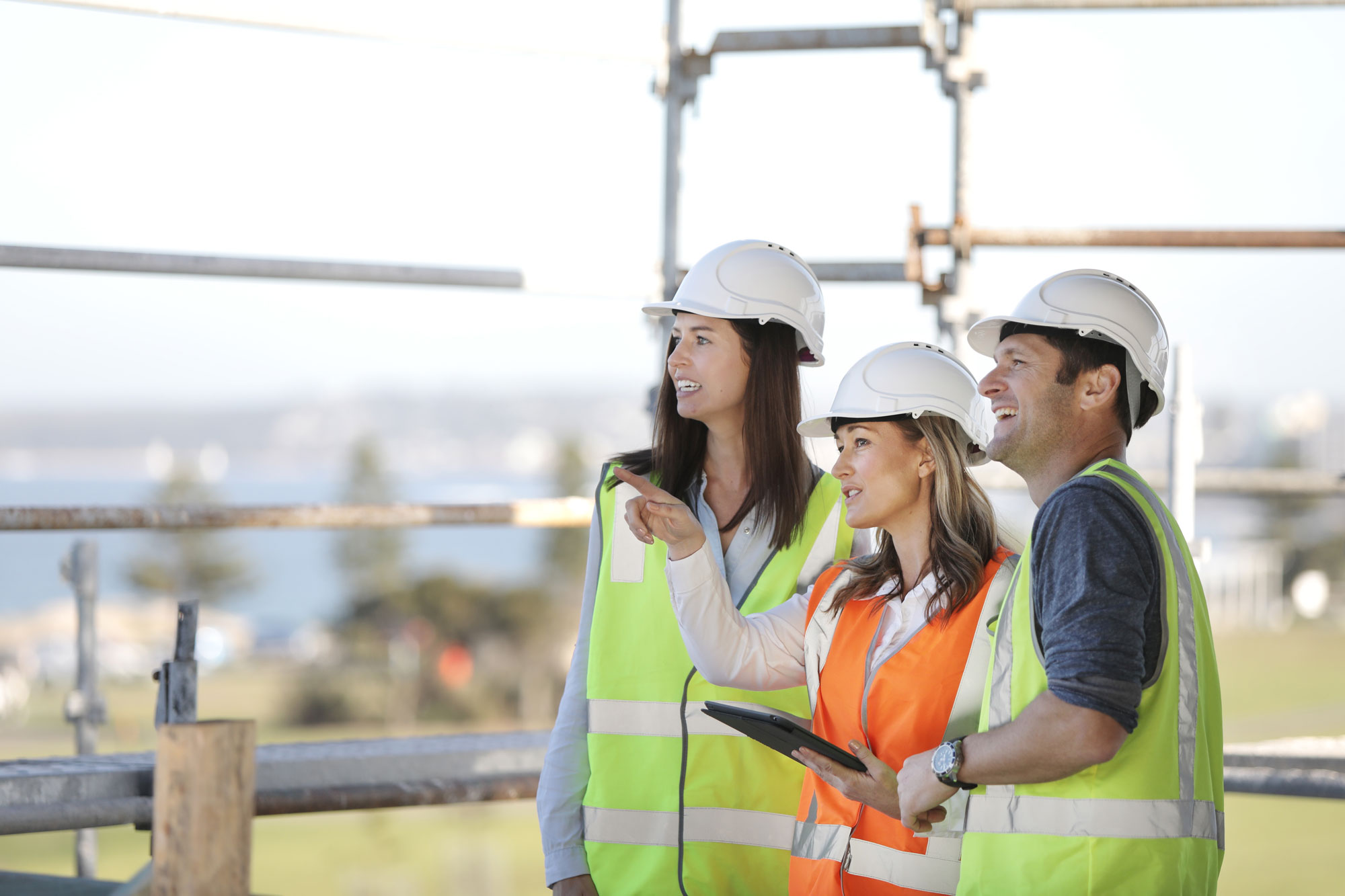 Female worker directing construction workers