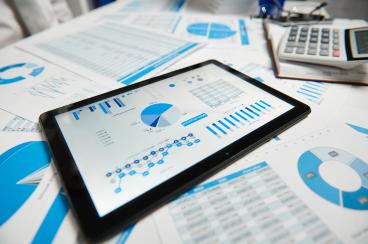 Tablet siting on table with a data visualisation