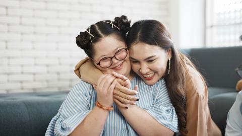 Two females hugging