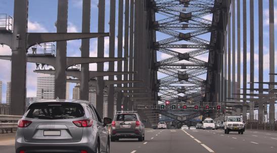 Driving across the Sydney Harbour Bridge heading south to the city